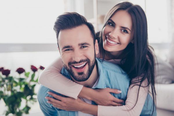 Couple Smiling With Beautiful Teeth
