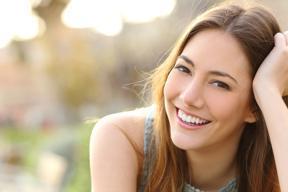 Woman Smiling With Dental Implants